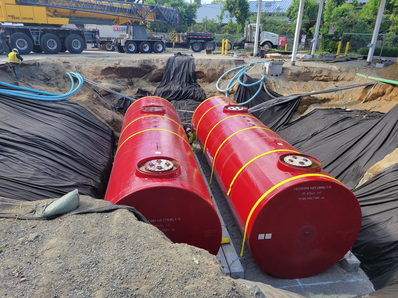 Oil drums and totes stored on racks and pallets to protect lubricants from moisture and dirt